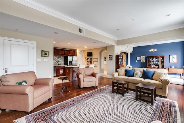 1350 Westwood Ave Unit 406, Richmond, VA 23227 - living room with crown molding, light wood-style floors, arched walkways, a chandelier, and baseboards