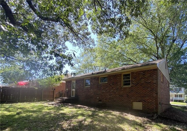 205 N Beech Ave, Henrico, VA 23075 - rear view of house with brick siding and crawl space