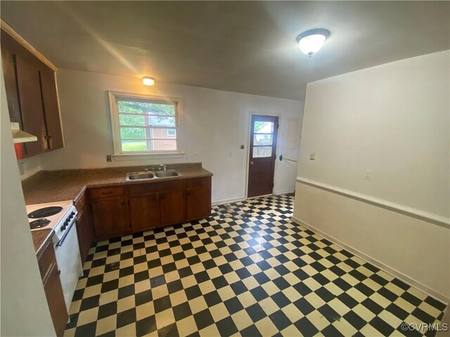 205 N Beech Ave, Henrico, VA 23075 - kitchen with light floors, white electric stove, a sink, and dark countertops
