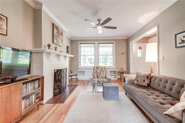 3429 Hanover Ave, Richmond, VA 23221 - living room with wood finished floors, a ceiling fan, crown molding, and a fireplace