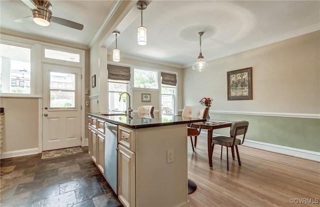 3429 Hanover Ave, Richmond, VA 23221 - kitchen with crown molding, a sink, dark countertops, baseboards, and stainless steel dishwasher