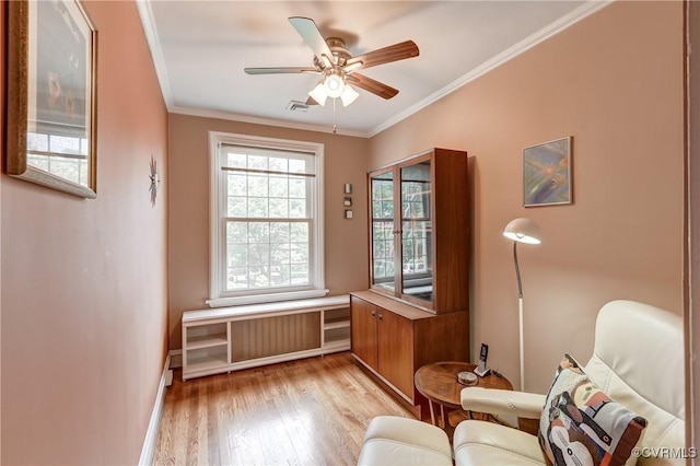 3429 Hanover Ave, Richmond, VA 23221 - sitting room with light wood-style flooring, ornamental molding, ceiling fan, baseboards, and radiator heating unit