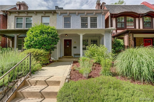 3429 Hanover Ave, Richmond, VA 23221 - view of front of home with a chimney, brick siding, and a porch