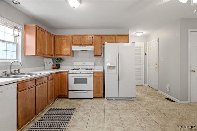 1117 Lees Crossing Ct, Glen Allen, VA 23059 - kitchen with white appliances, a sink, under cabinet range hood, and light countertops