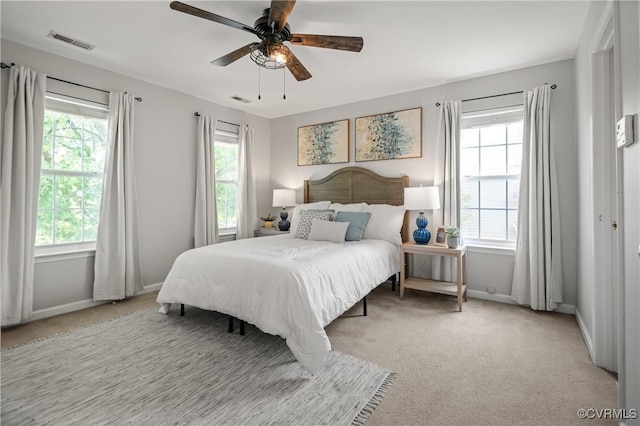 1117 Lees Crossing Ct, Glen Allen, VA 23059 - bedroom with multiple windows, light carpet, baseboards, and a ceiling fan
