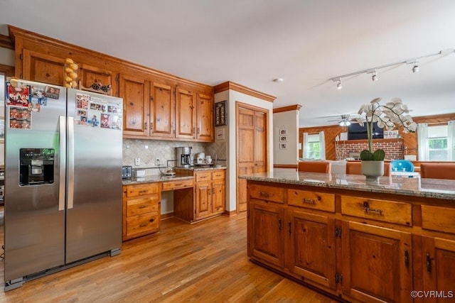 12601 W Patrick Henry Rd, Ashland, VA 23005 - kitchen featuring stainless steel fridge, brown cabinetry, light wood finished floors, backsplash, and a ceiling fan