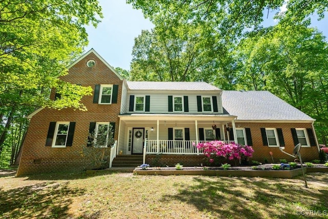 12601 W Patrick Henry Rd, Ashland, VA 23005 - view of front of house featuring covered porch, brick siding, and a front yard