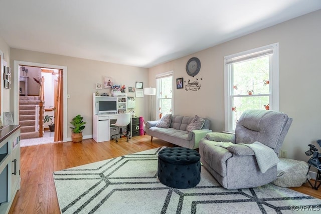 12601 W Patrick Henry Rd, Ashland, VA 23005 - living room featuring healthy amount of natural light, stairs, light wood-type flooring, and an office area