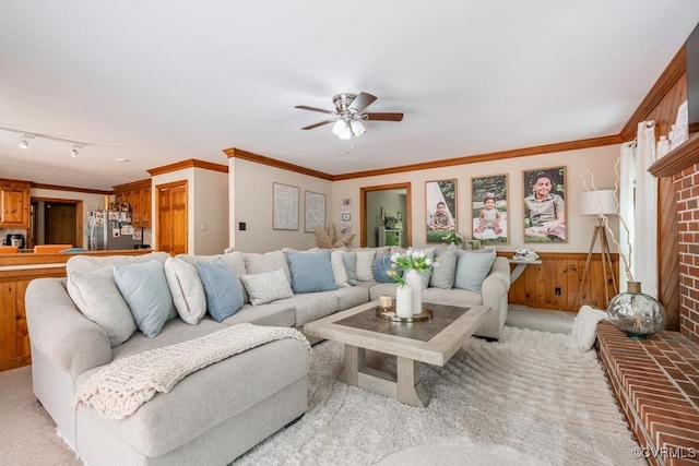 12601 W Patrick Henry Rd, Ashland, VA 23005 - living area with ceiling fan, a wainscoted wall, rail lighting, light colored carpet, and crown molding