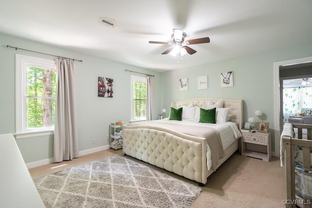 12601 W Patrick Henry Rd, Ashland, VA 23005 - bedroom featuring baseboards, light colored carpet, and a ceiling fan