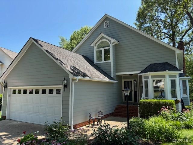 12513 Caitlin Cir, Henrico, VA 23233 - traditional-style home featuring roof with shingles, a chimney, concrete driveway, and a garage