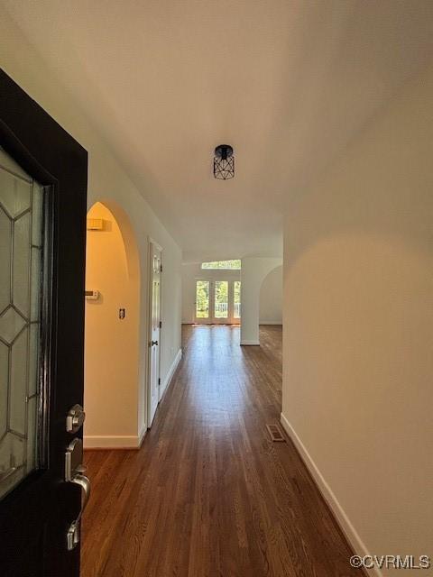 12513 Caitlin Cir, Henrico, VA 23233 - corridor with arched walkways and dark wood-style floors