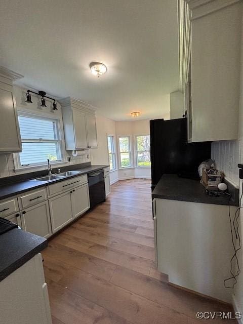 12513 Caitlin Cir, Henrico, VA 23233 - kitchen featuring dark countertops, black appliances, wood finished floors, and healthy amount of natural light