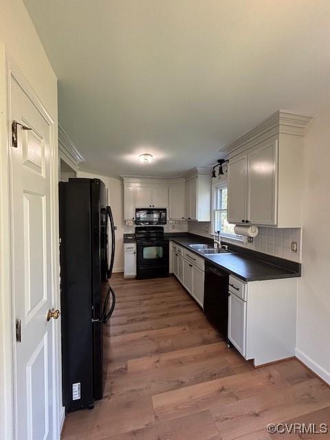 12513 Caitlin Cir, Henrico, VA 23233 - kitchen featuring black appliances, dark countertops, wood finished floors, and decorative backsplash