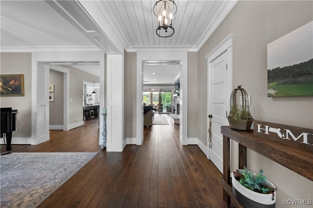 3397 Manor Oaks Dr, Powhatan, VA 23139 - entrance foyer with crown molding, a chandelier, and dark wood-type flooring