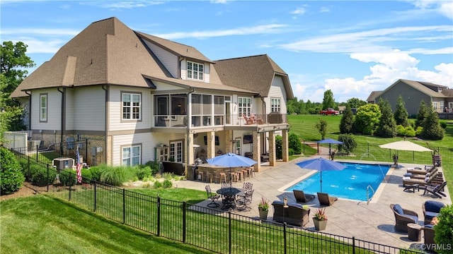 3397 Manor Oaks Dr, Powhatan, VA 23139 - back of property featuring a patio, a sunroom, and a shingled roof