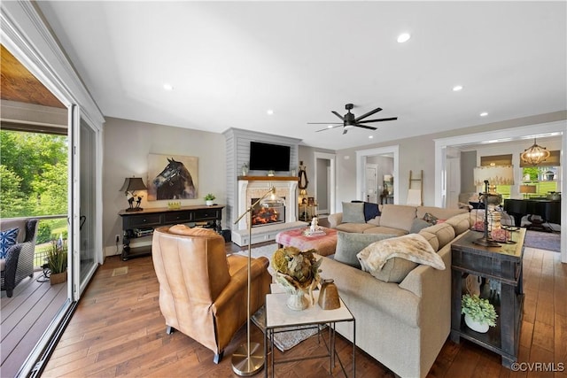 3397 Manor Oaks Dr, Powhatan, VA 23139 - living area with hardwood / wood-style floors, a lit fireplace, a ceiling fan, and recessed lighting