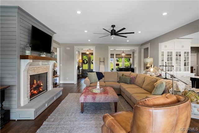 3397 Manor Oaks Dr, Powhatan, VA 23139 - living area featuring ceiling fan, a warm lit fireplace, dark wood-type flooring, and recessed lighting