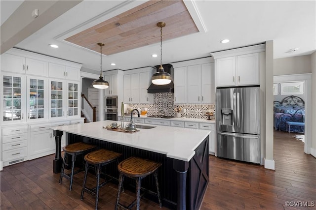 3397 Manor Oaks Dr, Powhatan, VA 23139 - kitchen with stainless steel appliances, dark wood-style floors, white cabinetry, light countertops, and tasteful backsplash