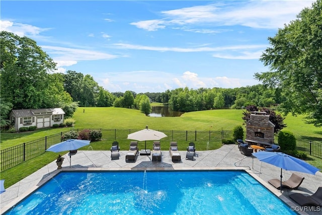 3397 Manor Oaks Dr, Powhatan, VA 23139 - view of pool with an outdoor stone fireplace, a patio, a water view, and view of wooded area