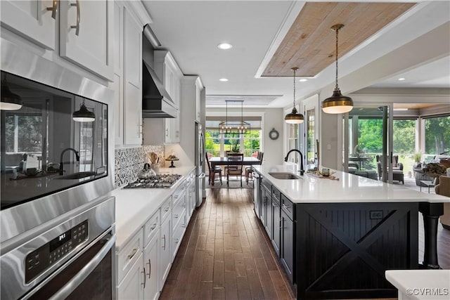 3397 Manor Oaks Dr, Powhatan, VA 23139 - kitchen with stainless steel appliances, white cabinetry, light countertops, dark wood-type flooring, and recessed lighting