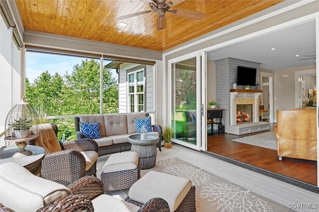 3397 Manor Oaks Dr, Powhatan, VA 23139 - sunroom with a ceiling fan and an outdoor living space with a fireplace