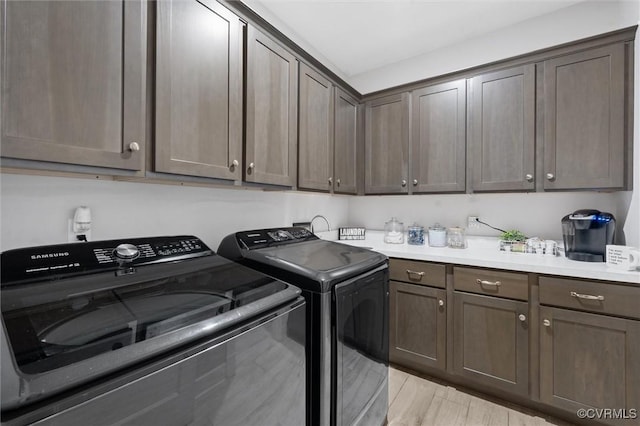 3397 Manor Oaks Dr, Powhatan, VA 23139 - washroom featuring cabinet space, washing machine and clothes dryer, and light wood-type flooring