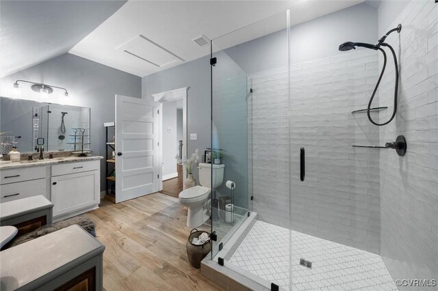 3397 Manor Oaks Dr, Powhatan, VA 23139 - full bath with wood finished floors, a stall shower, vanity, and vaulted ceiling