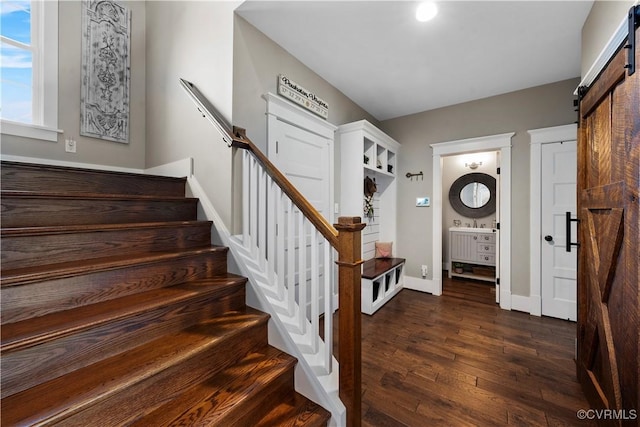 3397 Manor Oaks Dr, Powhatan, VA 23139 - foyer entrance with a barn door, dark wood-type flooring, and stairs