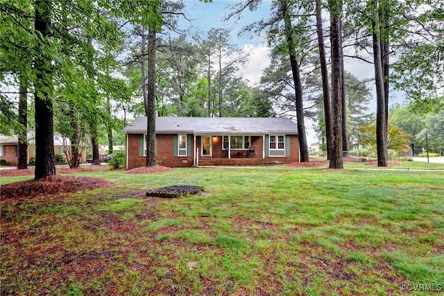 603 Pleasant St, Henrico, VA 23075 - ranch-style house with brick siding and a front yard
