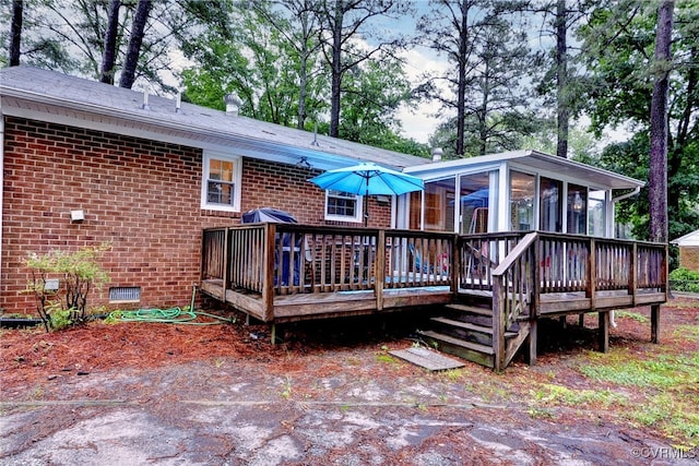 603 Pleasant St, Henrico, VA 23075 - rear view of property with a sunroom, brick siding, and a deck