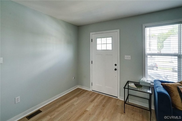 3107 Q St, Richmond, VA 23223 - foyer entrance with light wood-style flooring and baseboards