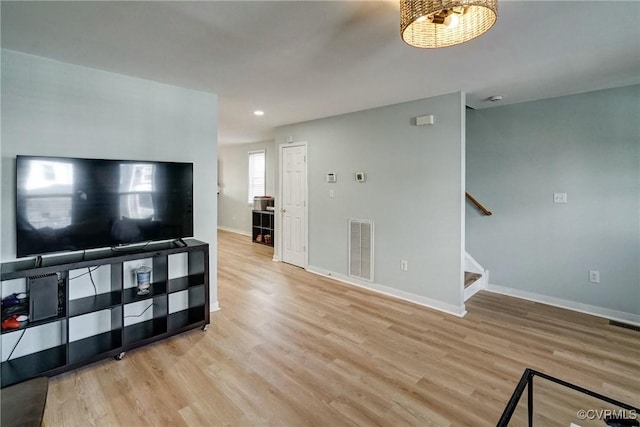 3107 Q St, Richmond, VA 23223 - unfurnished living room with light wood-style floors, stairs, and recessed lighting