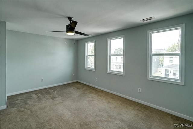 3107 Q St, Richmond, VA 23223 - carpeted empty room with baseboards and a ceiling fan