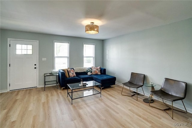 3107 Q St, Richmond, VA 23223 - living area featuring light wood-style flooring and baseboards