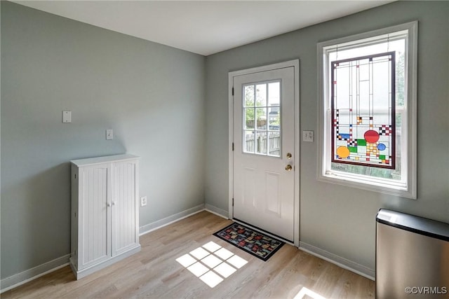 3107 Q St, Richmond, VA 23223 - entryway with light wood-style flooring and baseboards