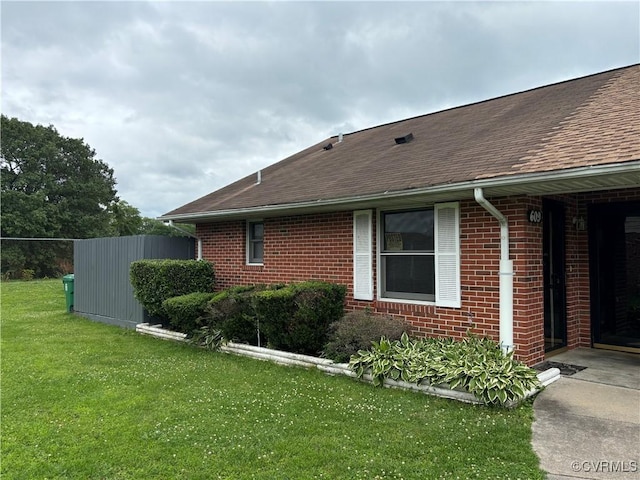 609 Carter St, Petersburg, VA 23803 - view of home's exterior with brick siding and a shingled roof