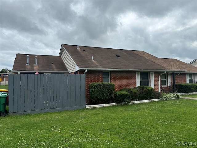609 Carter St, Petersburg, VA 23803 - view of property exterior featuring brick siding, a lawn, and a shingled roof