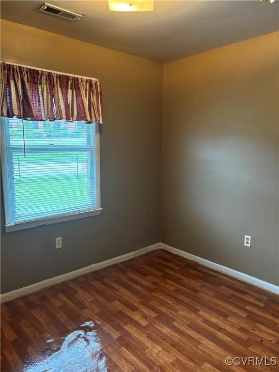 609 Carter St, Petersburg, VA 23803 - spare room with wood finished floors and baseboards