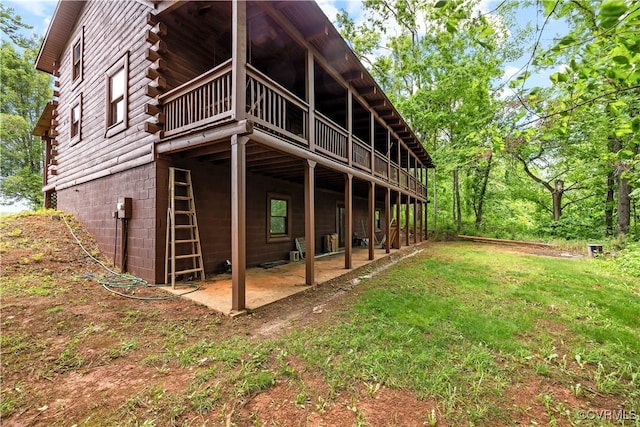 10 N River Ct, Cartersville, VA 23027 - rear view of property featuring log siding, a wooden deck, and a patio