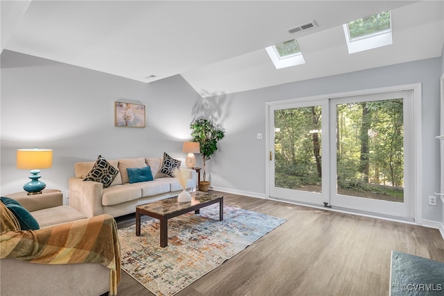 1417 Sycamore Mews Cir, Midlothian, VA 23113 - living room featuring a skylight, wood finished floors, and lofted ceiling