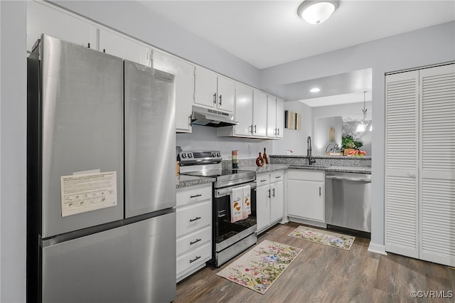 1417 Sycamore Mews Cir, Midlothian, VA 23113 - kitchen featuring appliances with stainless steel finishes, under cabinet range hood, dark wood-type flooring, white cabinets, and light stone countertops