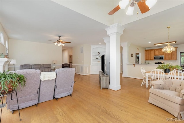 160 Walnut Ridge Dr, Stafford, VA 22556 - living room featuring ceiling fan, ornate columns, light wood-style floors, and built in shelves