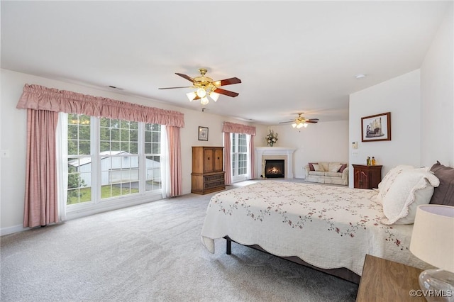 160 Walnut Ridge Dr, Stafford, VA 22556 - carpeted bedroom featuring a ceiling fan and a lit fireplace