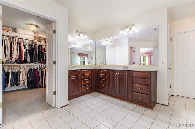 160 Walnut Ridge Dr, Stafford, VA 22556 - bathroom with double vanity, a chandelier, baseboards, and tile patterned floors