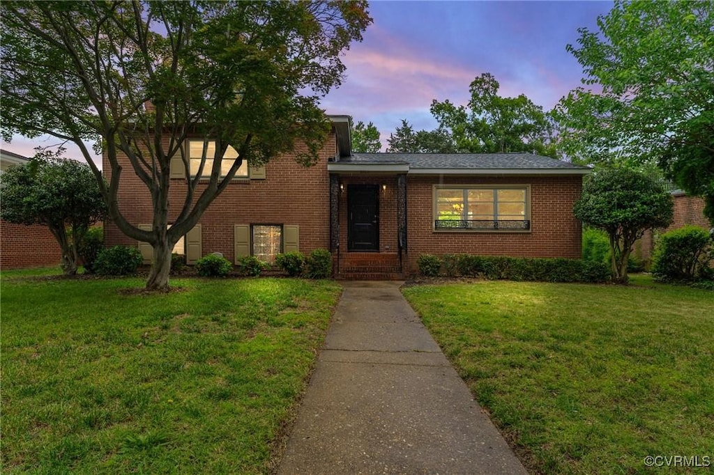 2503 Brook Rd, Richmond, VA 23220 - split level home featuring a front lawn and brick siding