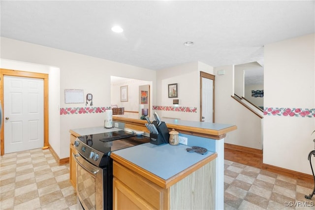 17 Brougham Rd, Fluvanna, VA 22963 - kitchen featuring electric range, light flooring, baseboards, a kitchen island, and recessed lighting