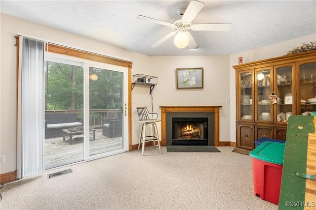 17 Brougham Rd, Fluvanna, VA 22963 - living area featuring carpet, a fireplace with flush hearth, baseboards, ceiling fan, and a textured ceiling