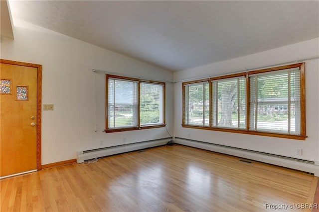 449 Martha Lee Dr, New Market, VA 23666 - unfurnished room with wood finished floors, lofted ceiling, and baseboard heating