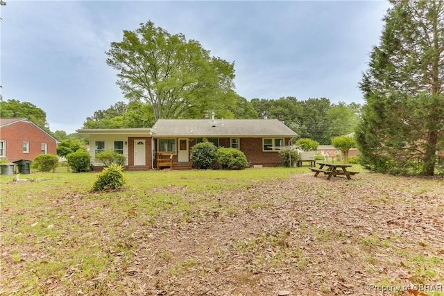 449 Martha Lee Dr, New Market, VA 23666 - back of house with brick siding and a yard
